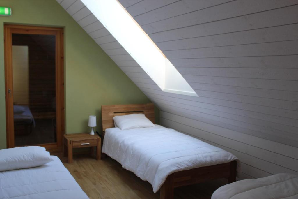 Postel nebo postele na pokoji v ubytování Rootsimaa Holiday House