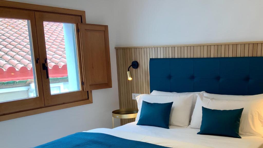 Posteľ alebo postele v izbe v ubytovaní La Baula Terraza, Boutique Apartament