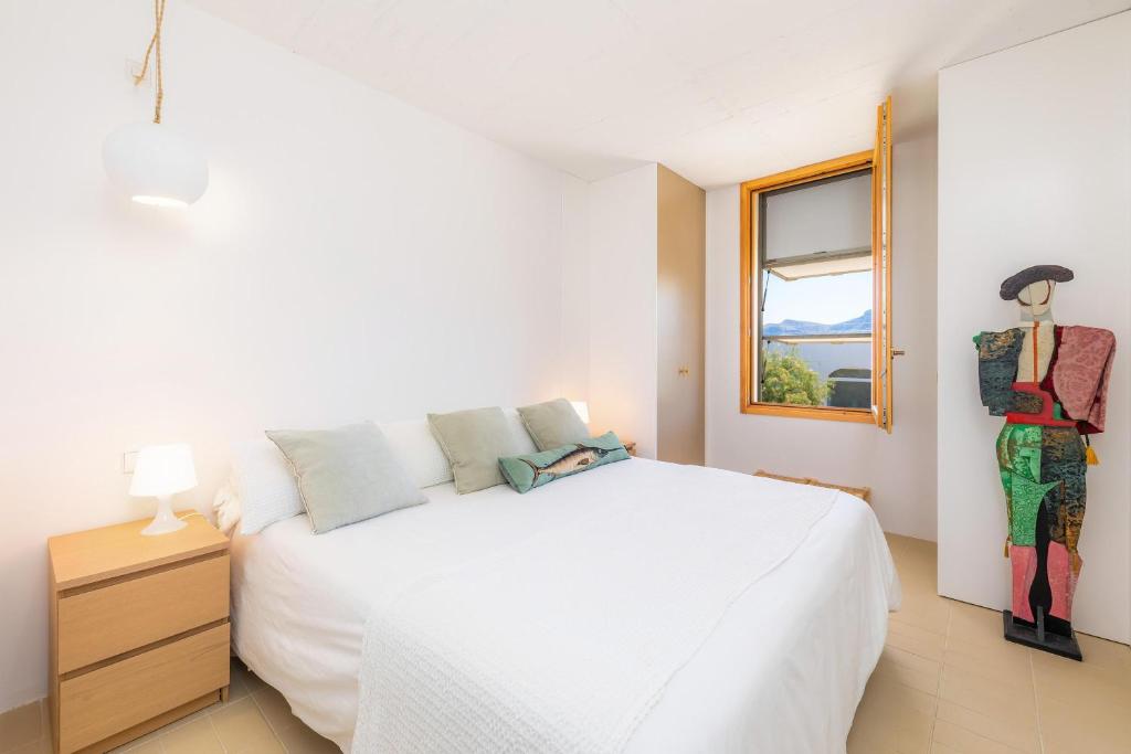 A bed or beds in a room at Es Mollet