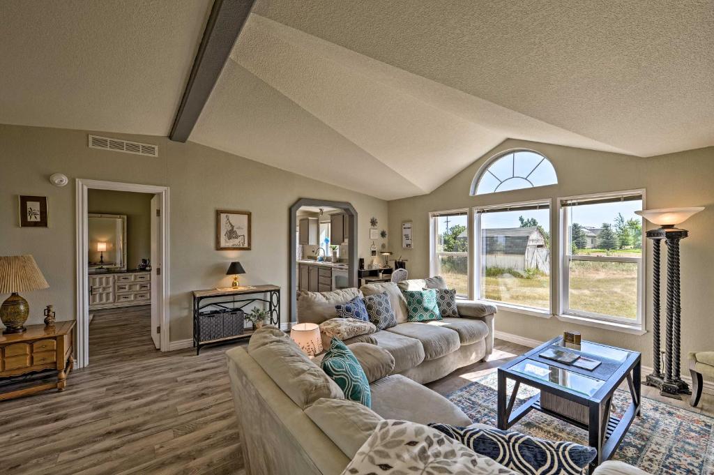 a living room with a couch and a table at Rural Rigby Family Home with Yard Hike, Boat and Ski! in Lorenzo