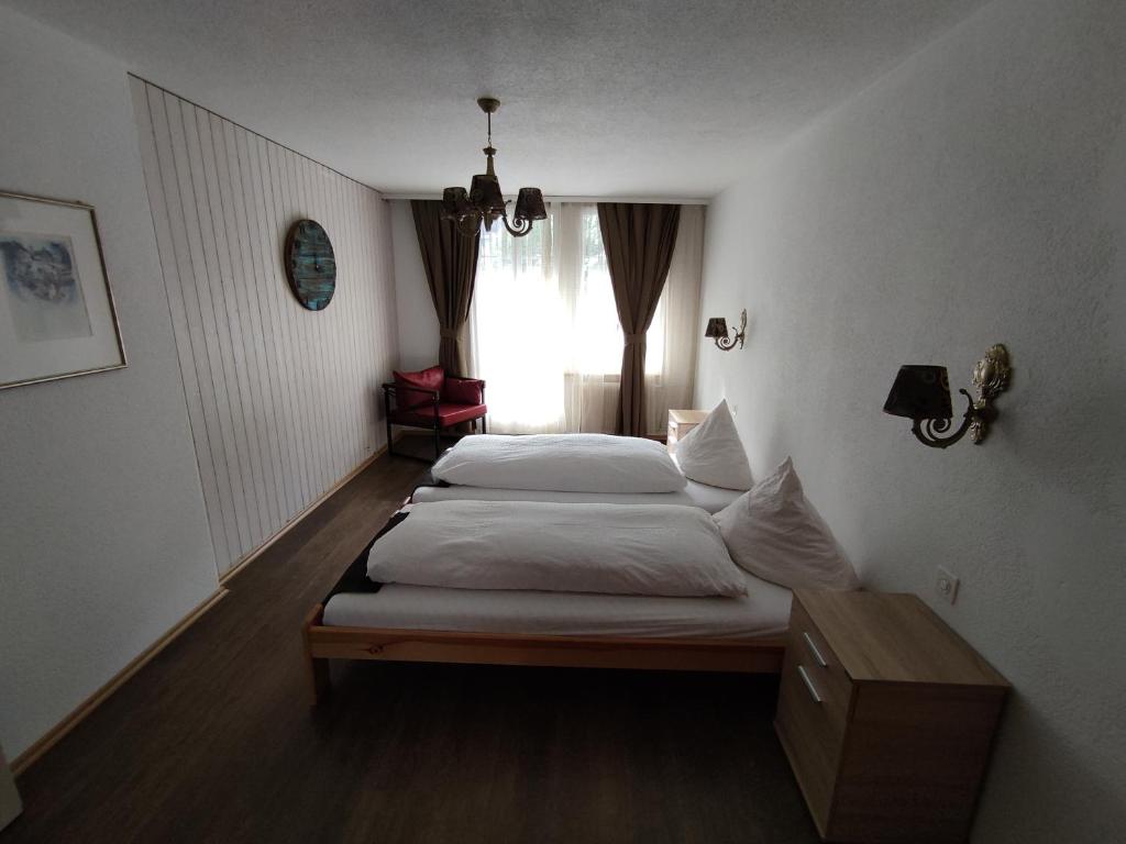 Postel nebo postele na pokoji v ubytování Hotel Restaurant Jungfrau