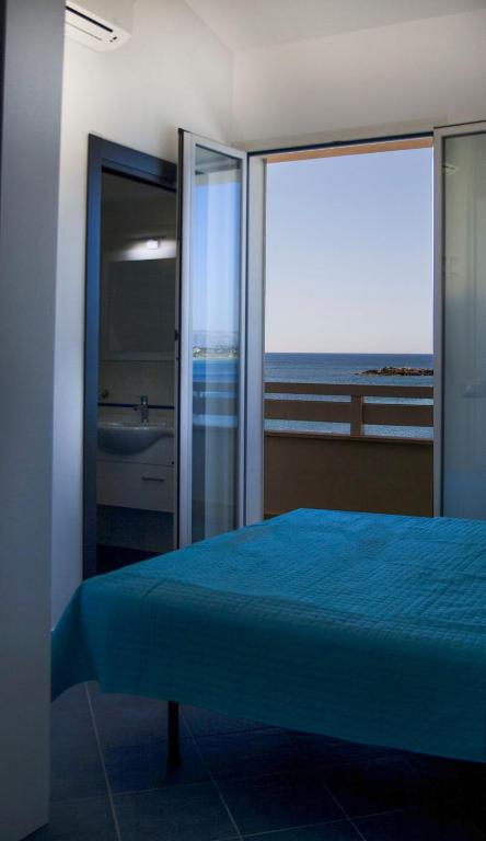 A bed or beds in a room at Villa Amateia