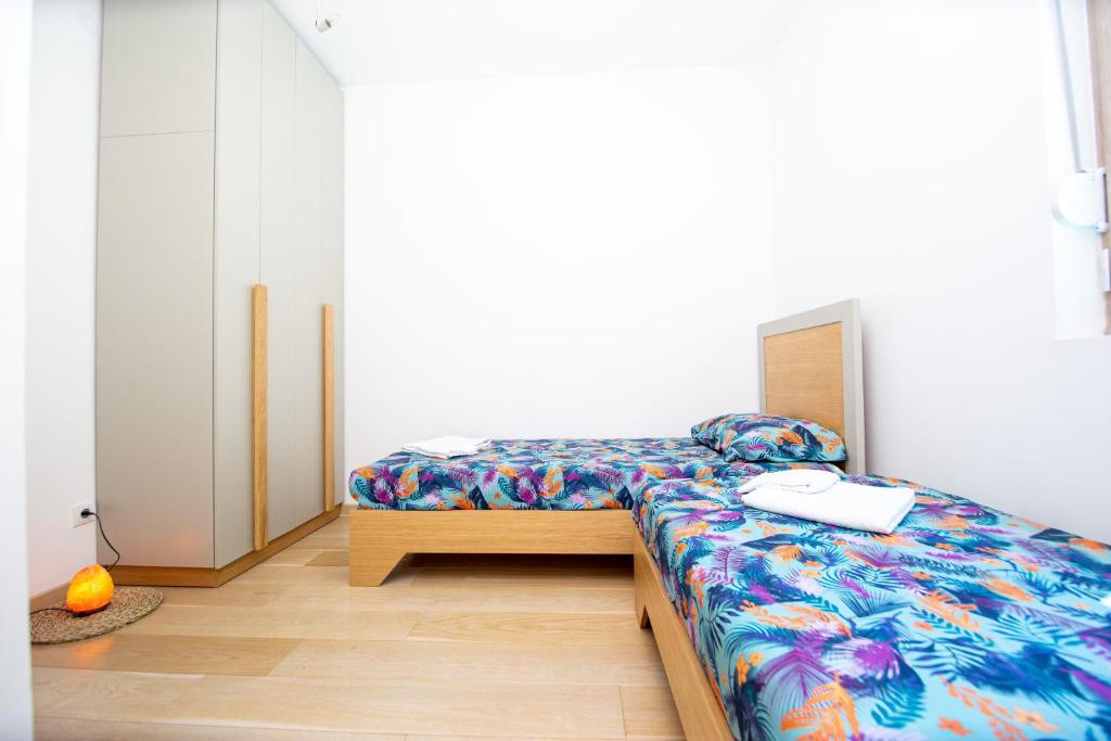 Postel nebo postele na pokoji v ubytování Apartman DULY LUX