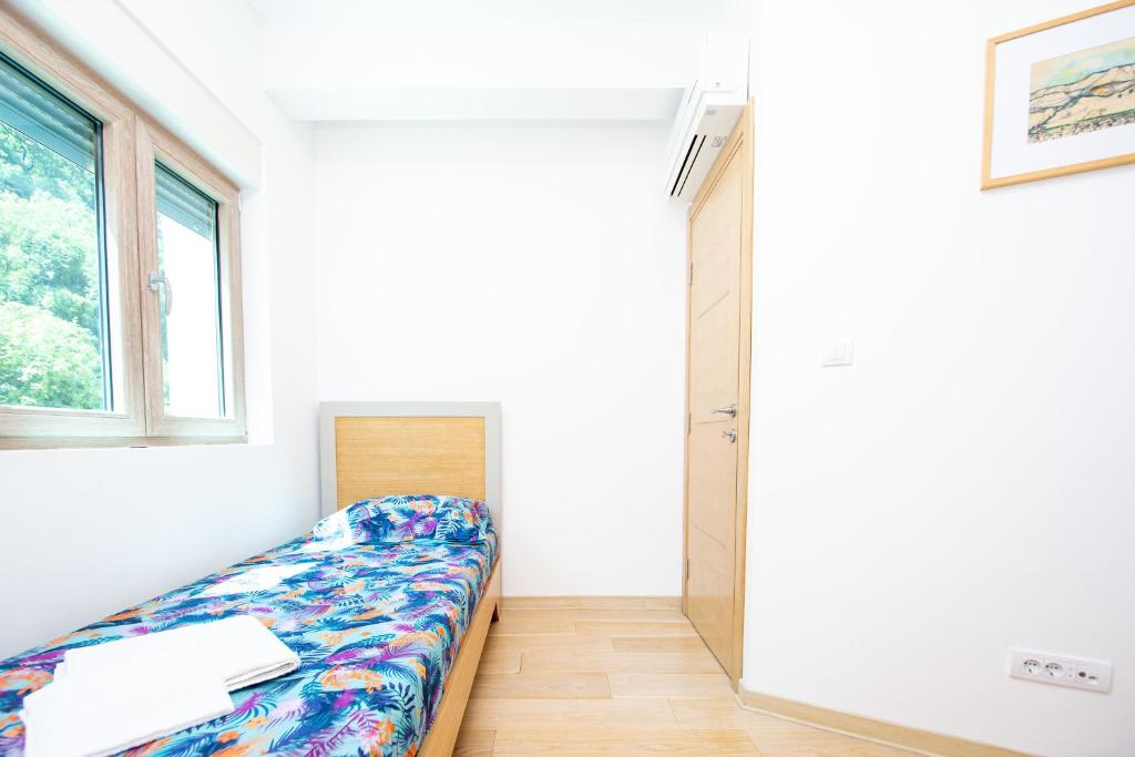 Postel nebo postele na pokoji v ubytování Apartman DULY LUX