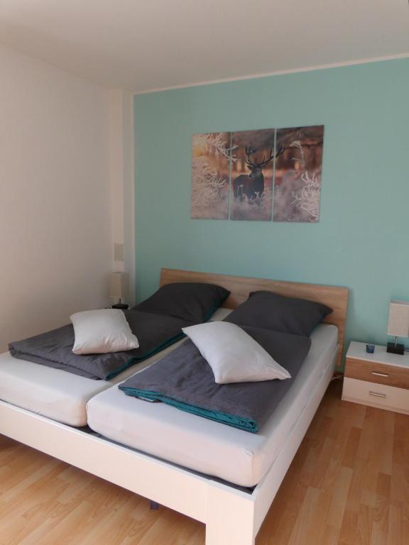 מיטה או מיטות בחדר ב-Ferienwohnung - Bothel