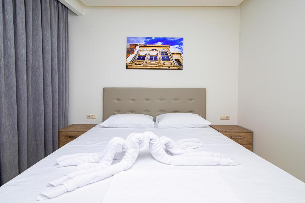 Postel nebo postele na pokoji v ubytování Amara Residences by Estia