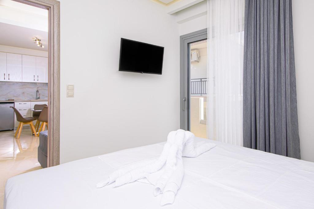 TV a/nebo společenská místnost v ubytování Amara Residences by Estia