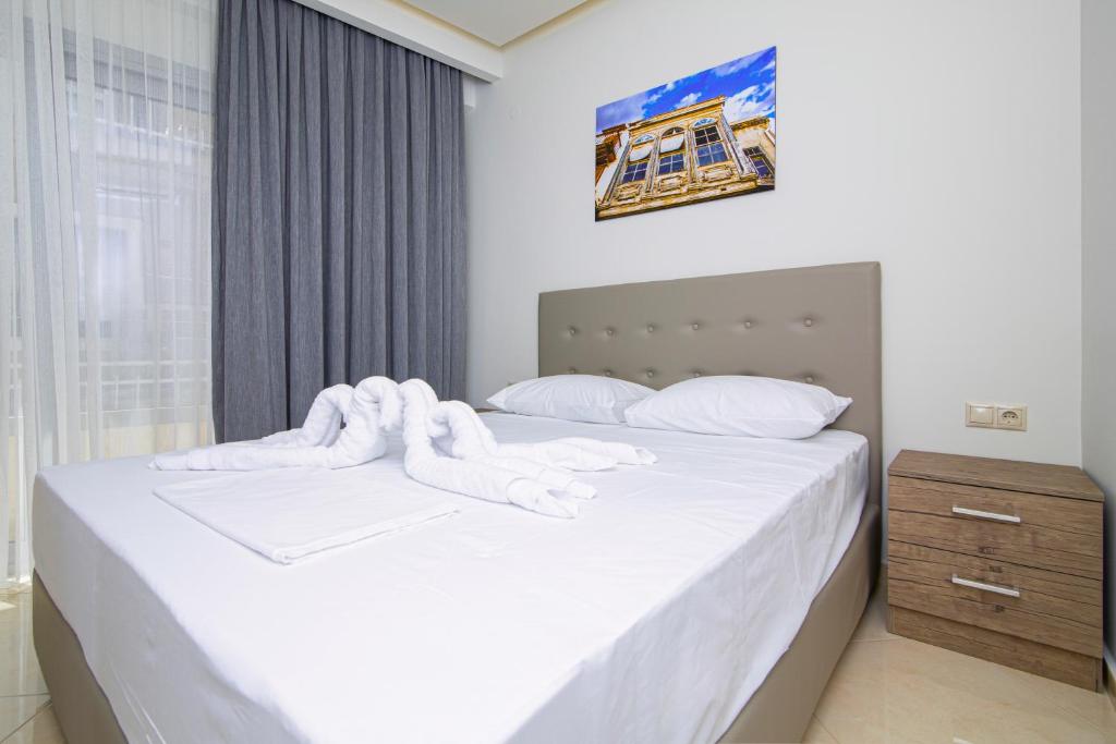 Postel nebo postele na pokoji v ubytování Amara Residences by Estia
