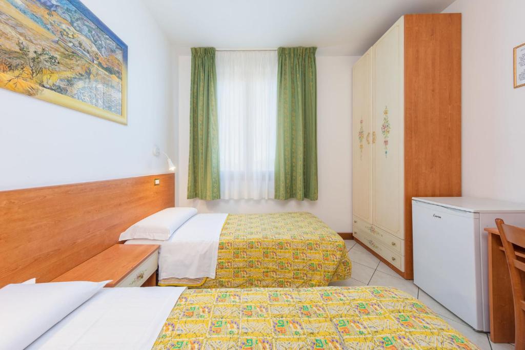 Posteľ alebo postele v izbe v ubytovaní Hotel New Aurora Venice