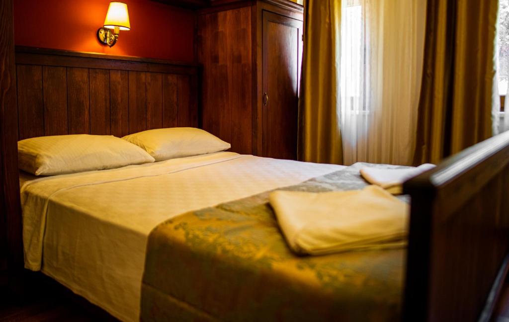 Postel nebo postele na pokoji v ubytování Dores Residence