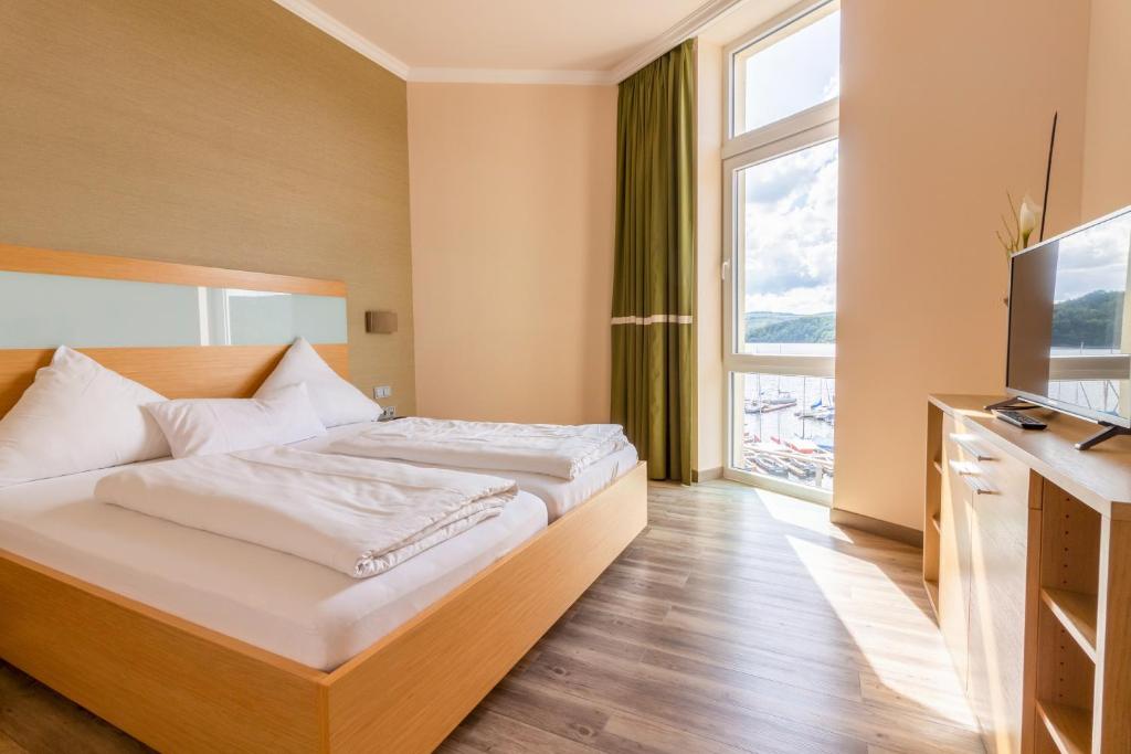 Postel nebo postele na pokoji v ubytování Der Seehof