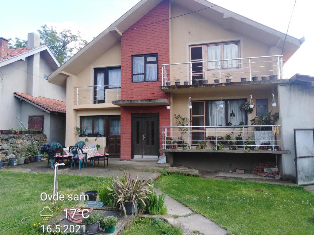 a house with a lawn in front of it at Smeštaj Urošević in Golubac