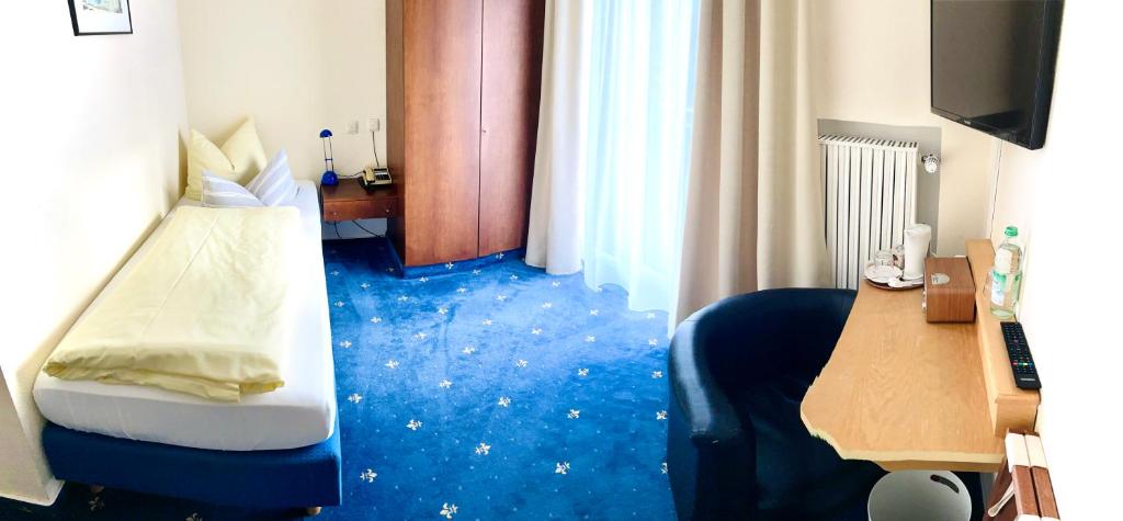 Postel nebo postele na pokoji v ubytování Hotel Sonnenspitz ***