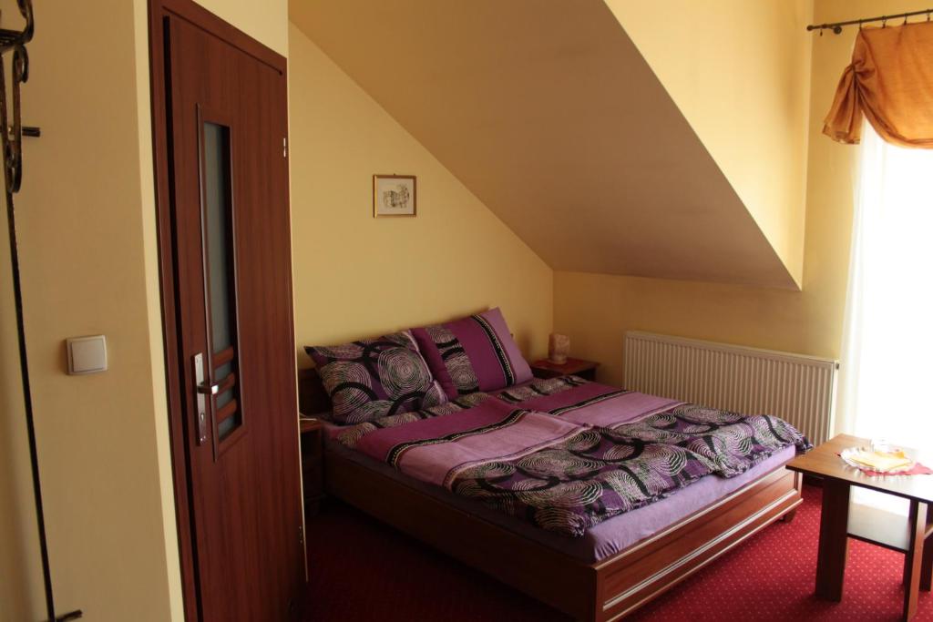 Postel nebo postele na pokoji v ubytování Zajazd Skorpion B&B