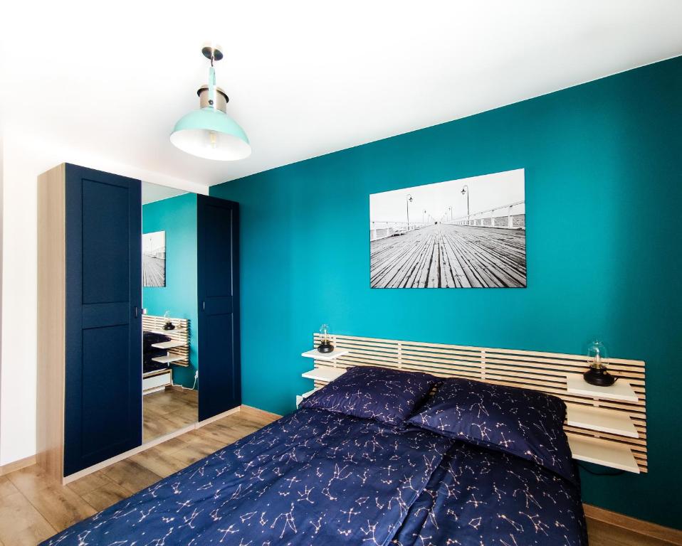 Posteľ alebo postele v izbe v ubytovaní SUNRISE HOME APARTMENTS - LIGHTHOUSE