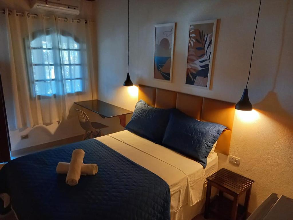 Cama ou camas em um quarto em Pousada Schueng