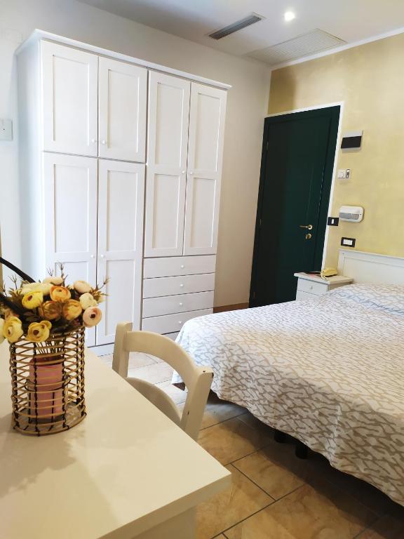 Postel nebo postele na pokoji v ubytování Hotel Ambrosiana