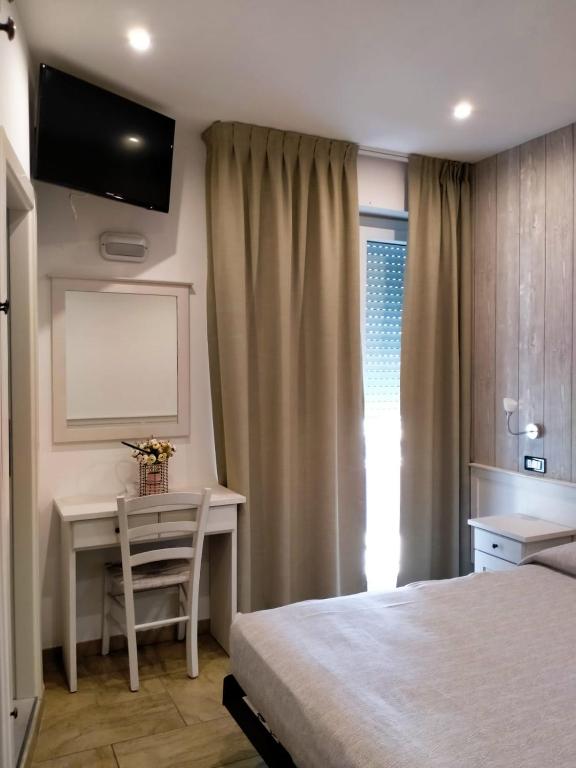 Postel nebo postele na pokoji v ubytování Hotel Ambrosiana