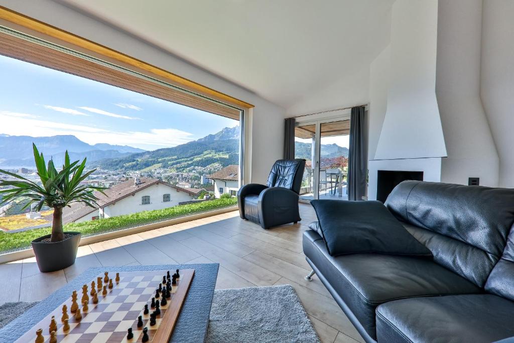 a living room with a couch and a chessboard at Young Backpackers Homestay in Luzern