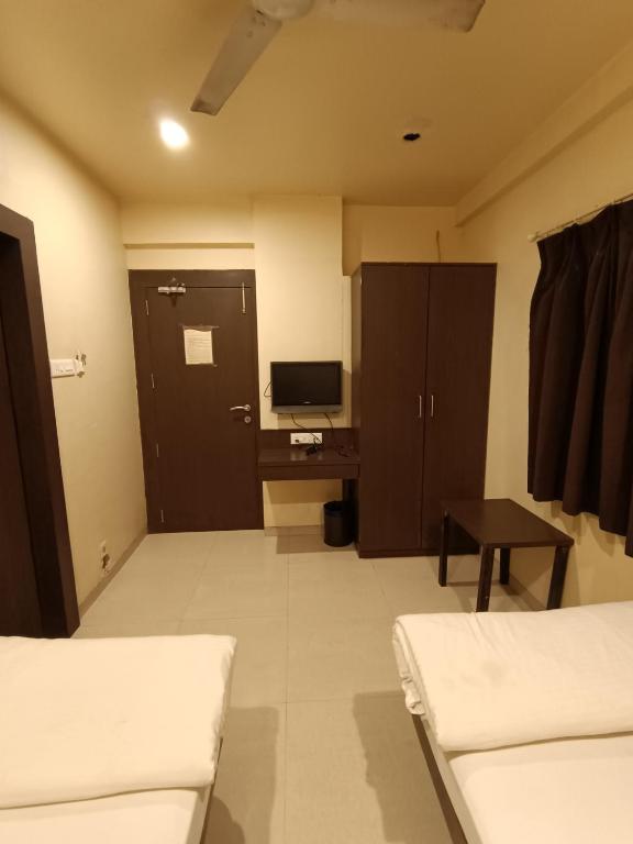 Postel nebo postele na pokoji v ubytování Hotel Solitaire