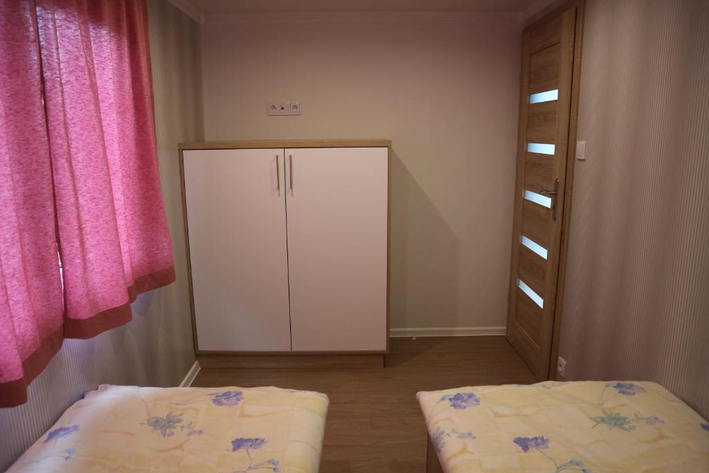 Postel nebo postele na pokoji v ubytování Amis apartmán 2