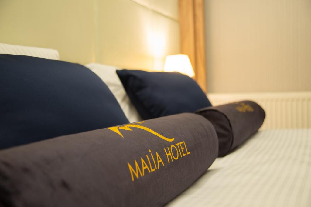 Postel nebo postele na pokoji v ubytování Malia otel