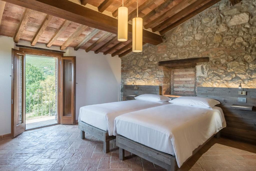 Posteľ alebo postele v izbe v ubytovaní Agriresort La Colombaia