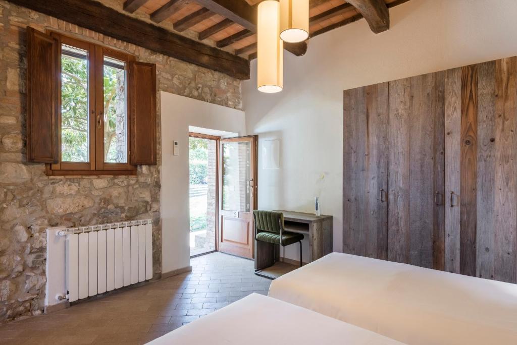 Posteľ alebo postele v izbe v ubytovaní Agriresort La Colombaia