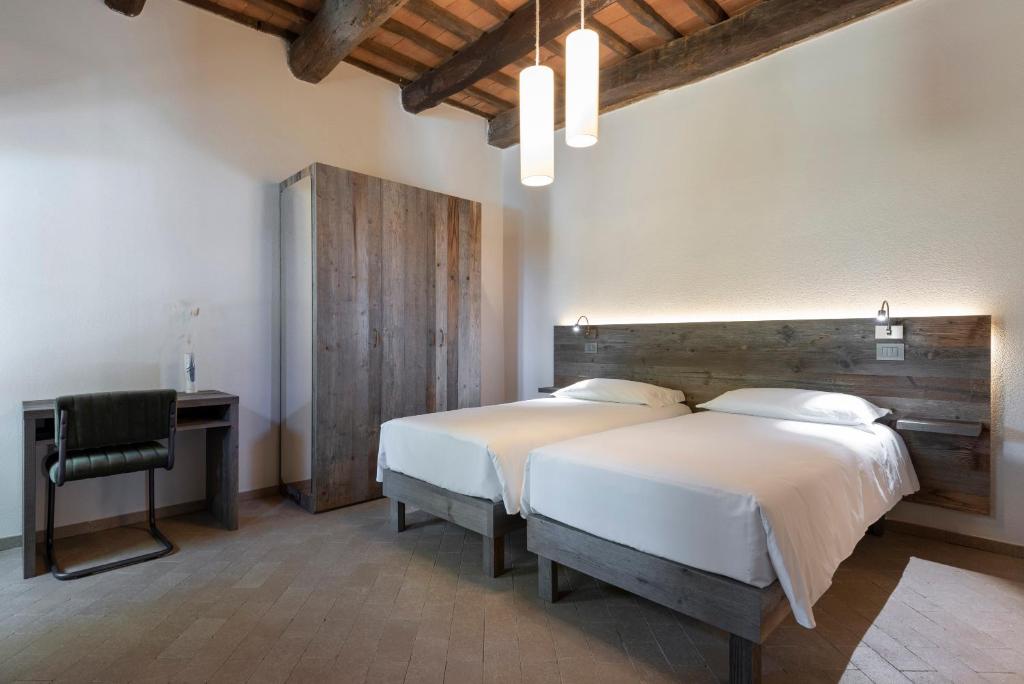 Posteľ alebo postele v izbe v ubytovaní Agriresort La Colombaia