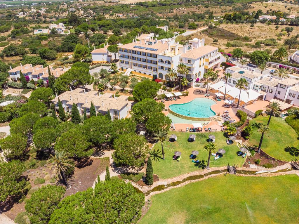an aerial view of a resort with a pool at Vale d'El Rei Hotel & Villas in Carvoeiro