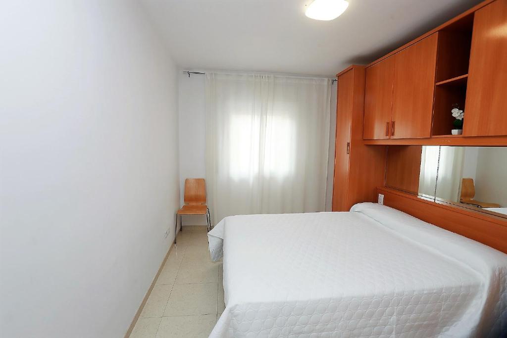 Posteľ alebo postele v izbe v ubytovaní Apartamento Plaça Jardí