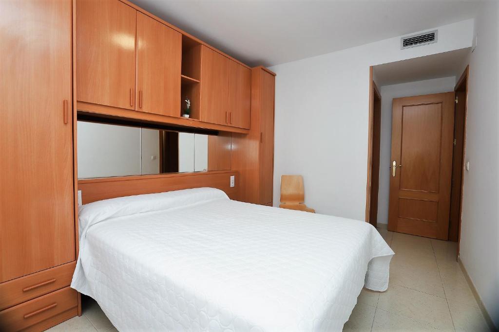 Posteľ alebo postele v izbe v ubytovaní Apartamento Plaça Jardí