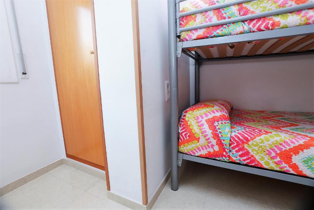 Posteľ alebo postele v izbe v ubytovaní Apartamento Plaça Jardí