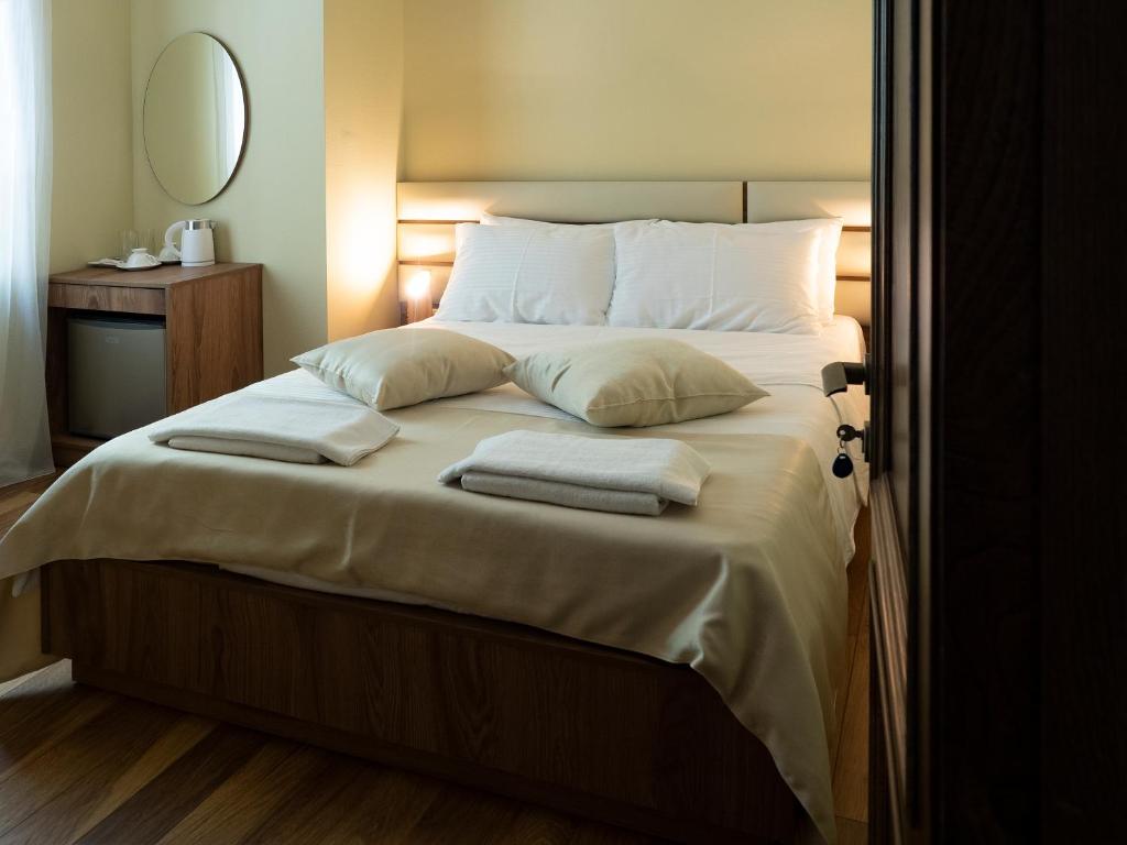 Postel nebo postele na pokoji v ubytování Boutique Hotel Filosofia