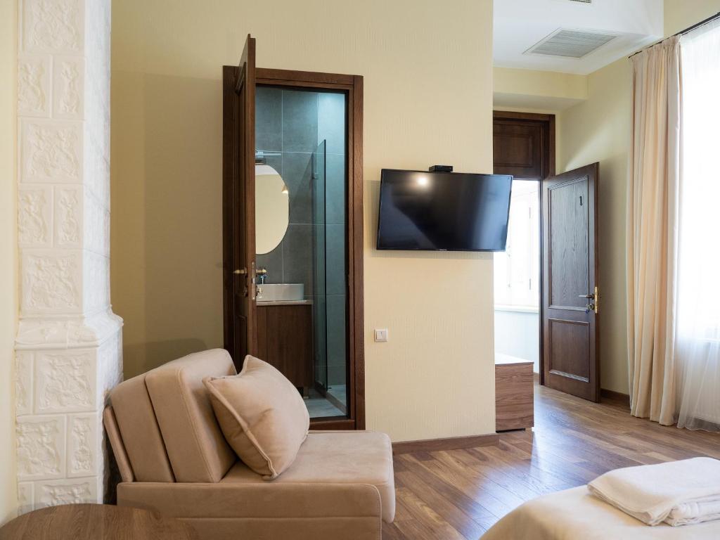 TV a/nebo společenská místnost v ubytování Boutique Hotel Filosofia