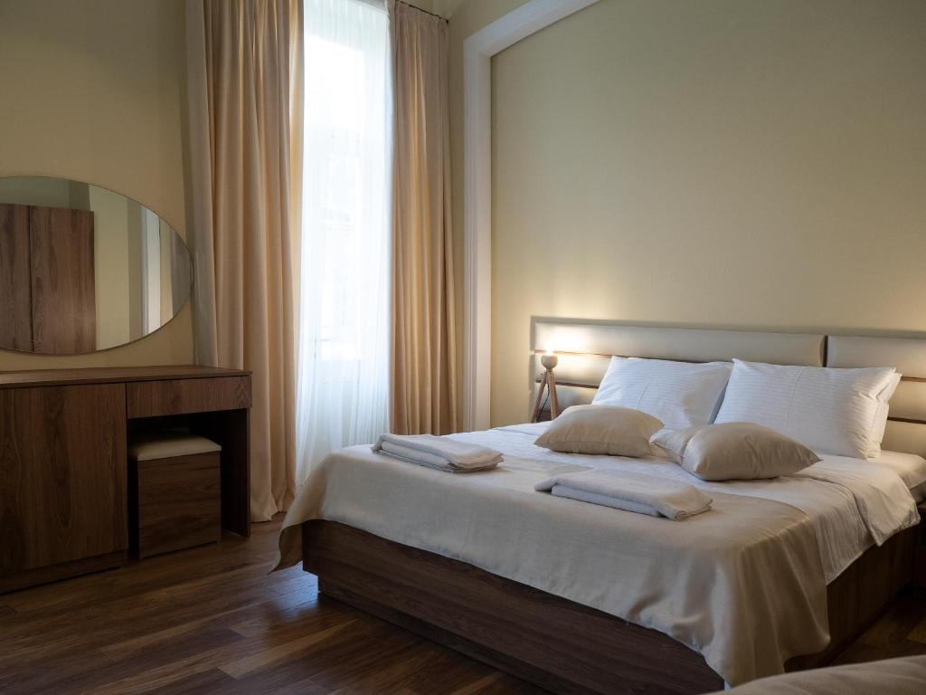 Postel nebo postele na pokoji v ubytování Boutique Hotel Filosofia