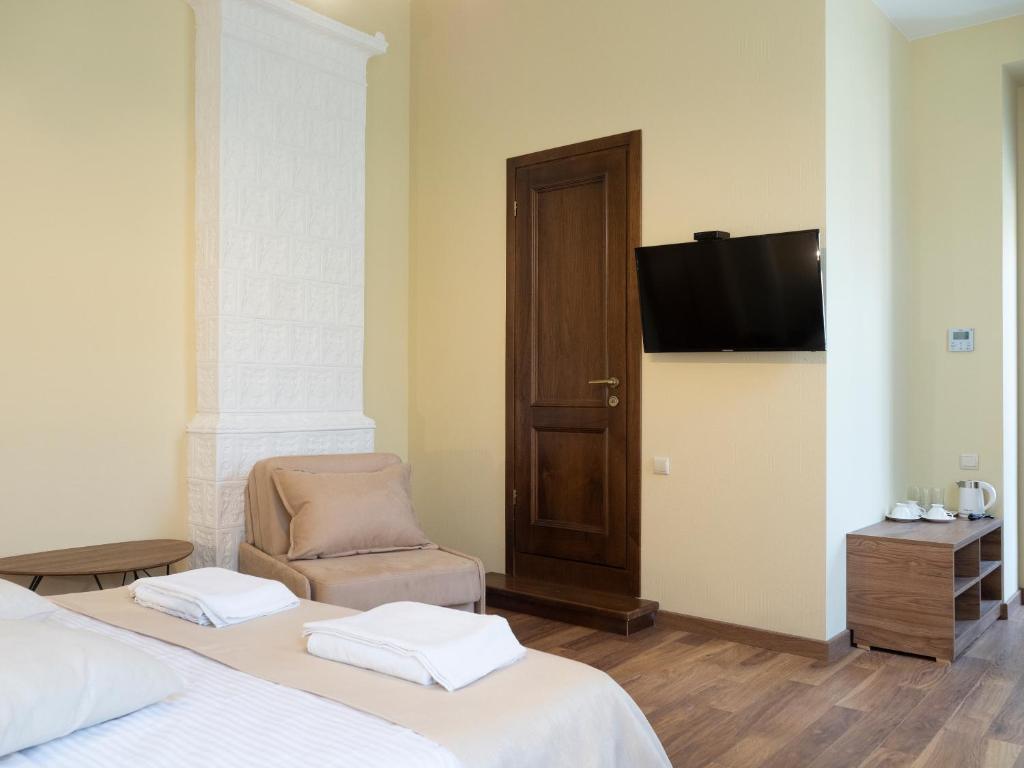 Postel nebo postele na pokoji v ubytování Boutique Hotel Filosofia