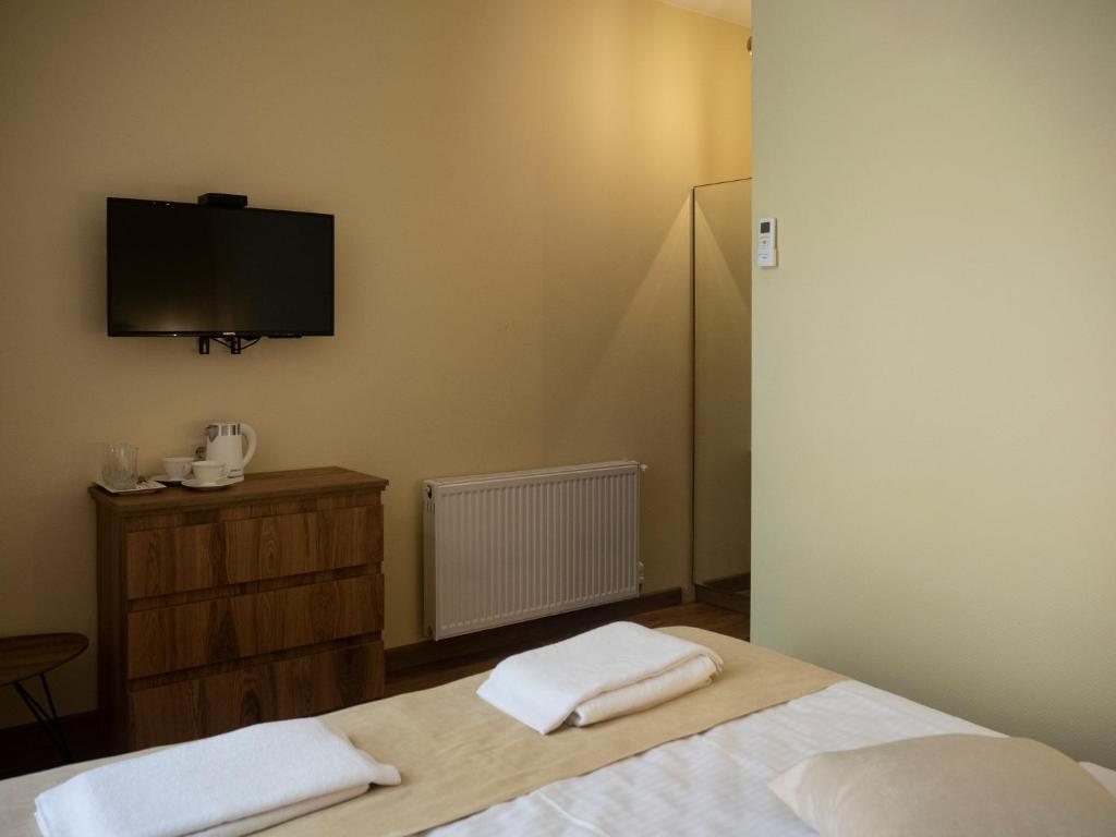 Postel nebo postele na pokoji v ubytování Boutique Hotel Filosofia