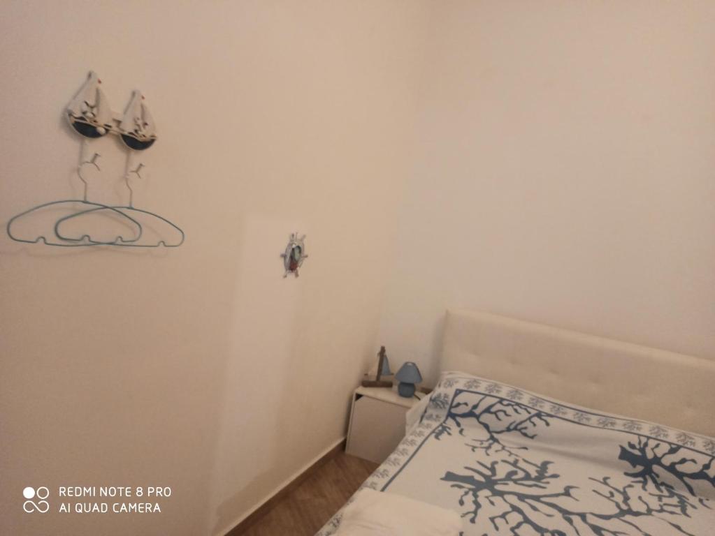 Łóżko lub łóżka w pokoju w obiekcie Casa Sferracavallo