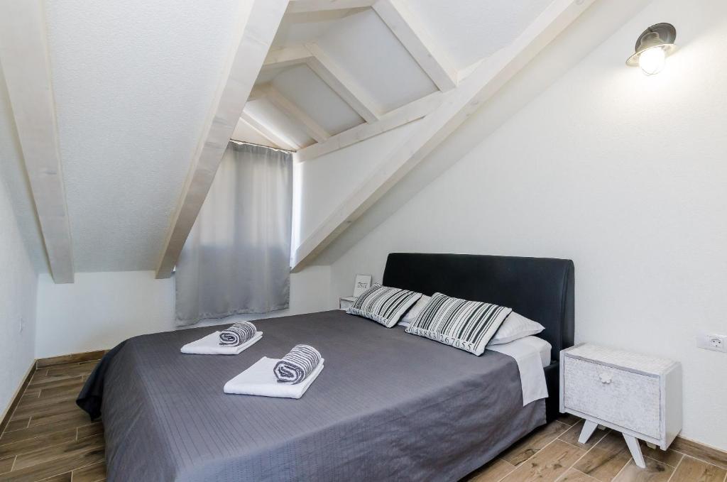Postel nebo postele na pokoji v ubytování Apartments Life