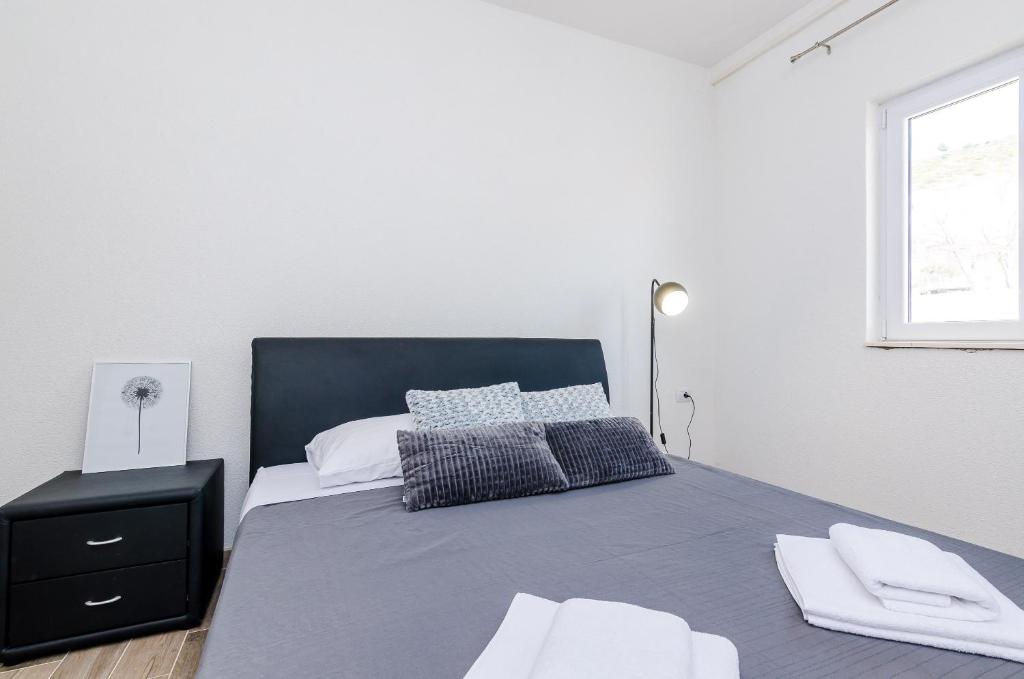 Postel nebo postele na pokoji v ubytování Apartments Life