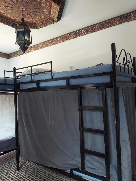 Una cama o camas en una habitación de Tangiers Hostel