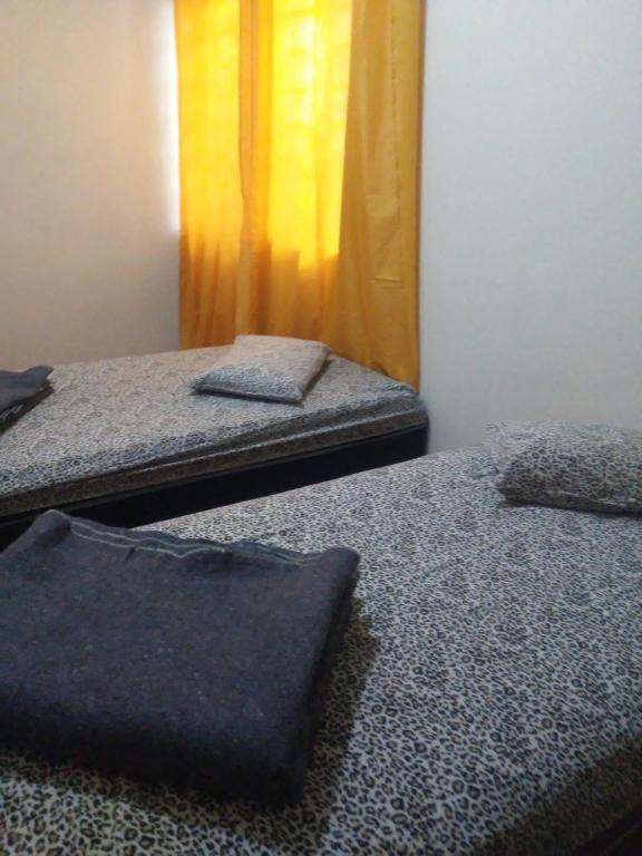 Postel nebo postele na pokoji v ubytování FLAT COM AREA GOURMET para ATÉ 8 PESSOAS