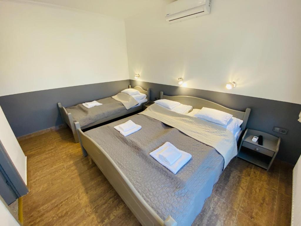 Postel nebo postele na pokoji v ubytování Linton Apartmanház