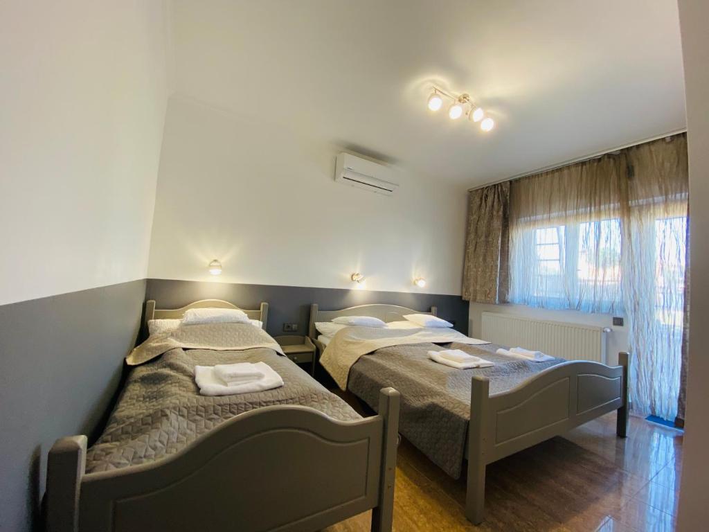 Postel nebo postele na pokoji v ubytování Linton Apartmanház