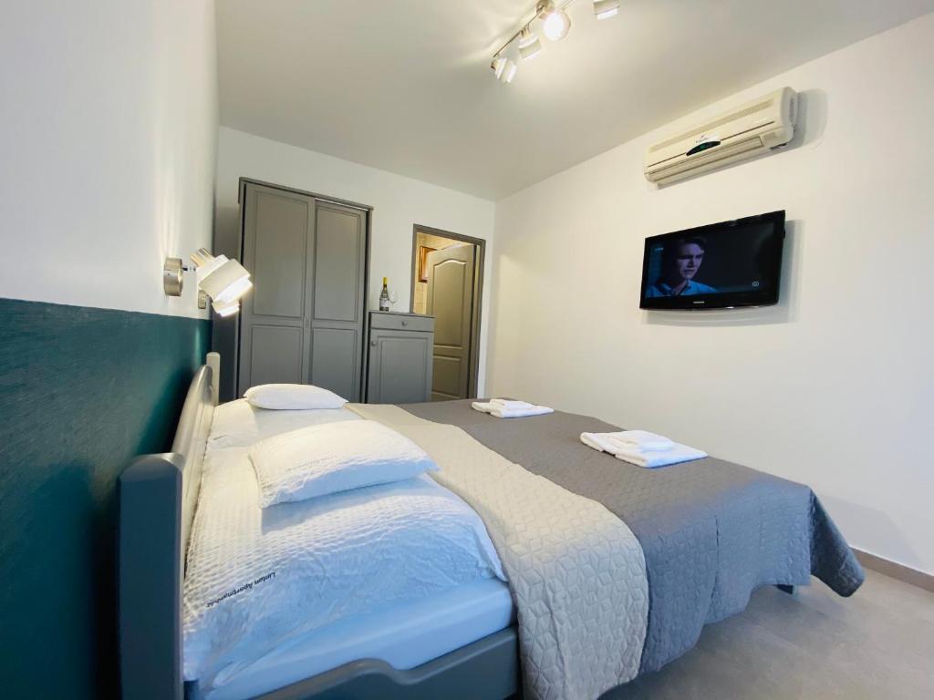 Postel nebo postele na pokoji v ubytování Linton Apartmanház
