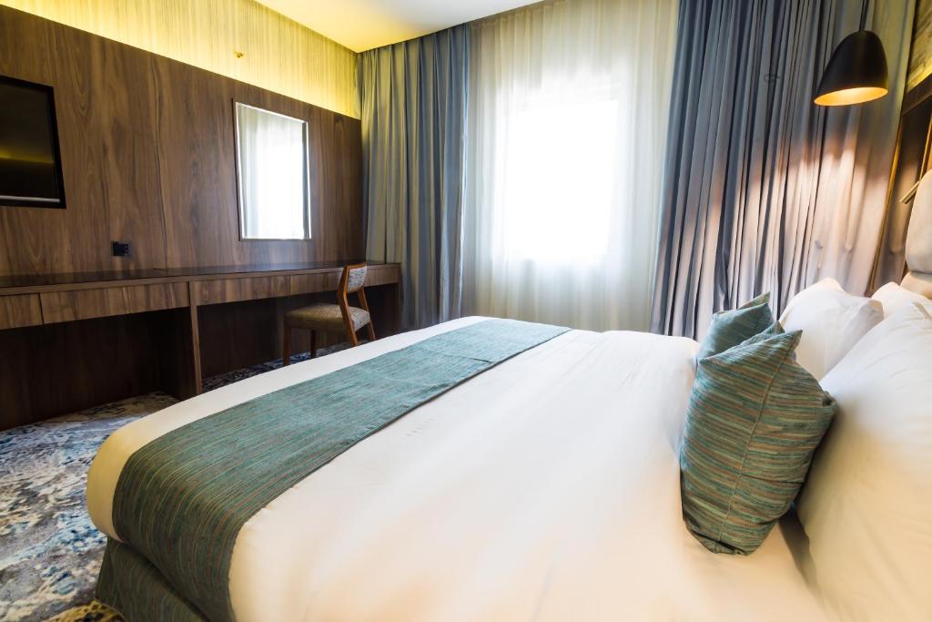 Postel nebo postele na pokoji v ubytování Wow Diamond - White Diamond Hotel Al Nuzha