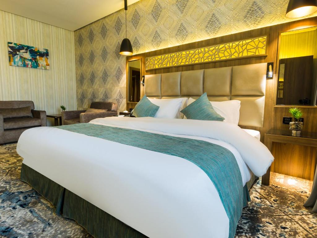 Postel nebo postele na pokoji v ubytování Wow Diamond - White Diamond Hotel Al Nuzha