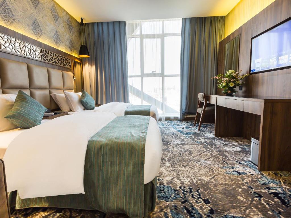 Postel nebo postele na pokoji v ubytování Wow Diamond - White Diamond Hotel Al Nuzha