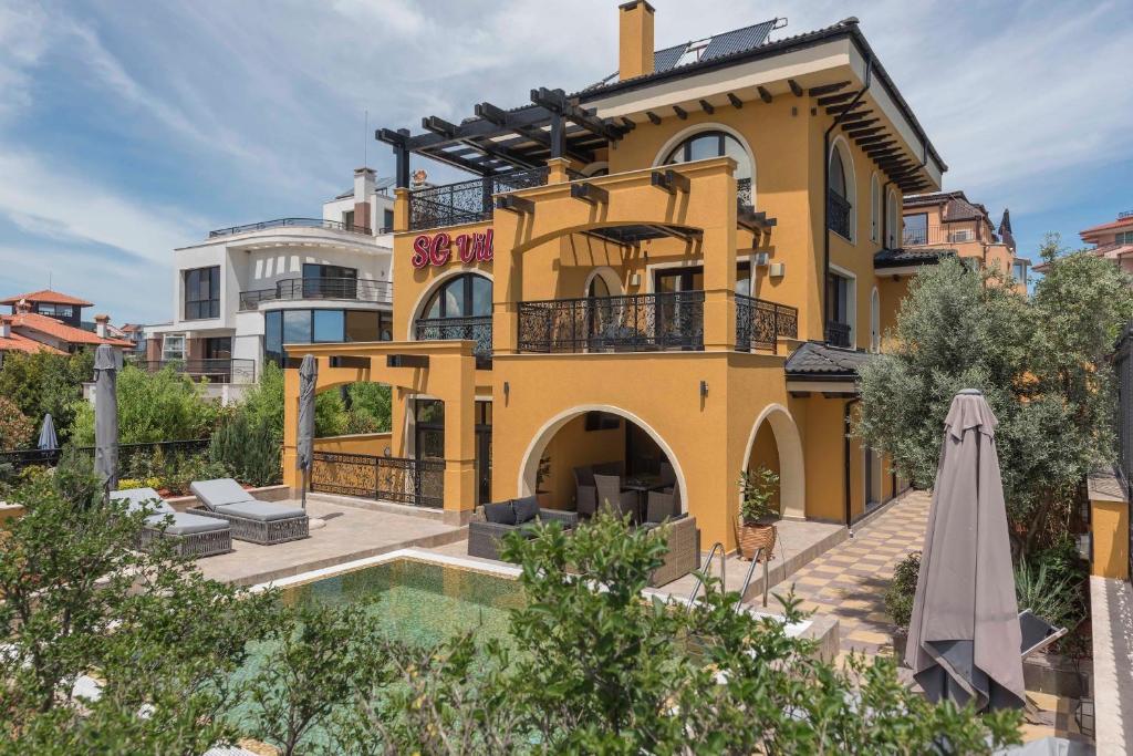 a house with a pool in front of it at SG Villa in Sozopol